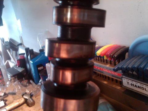 1988 Ford Bronco - Close-up of a camshaft, with a set of T-handle hex keys visible in the background.