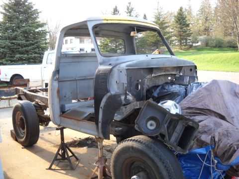 1954 Ford F-100 - This 1954 Ford F-100 cab is undergoing restoration, shown here on jack stands with its front end exposed.