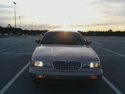 1996 Mercury Grand Marquis - This Mercury Grand Marquis is parked in a lot as the sun sets.