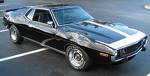 1991 Ford Bronco - This 1970s AMC Javelin AMX is parked in a lot, showing its distinctive body style.