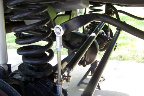 1990 Ford Bronco - The image shows the suspension system of a vehicle, including coil springs and various linkages.