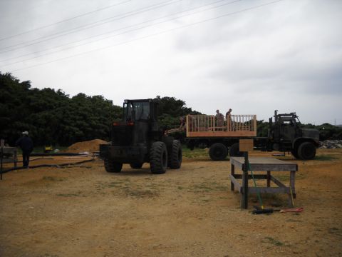 1986 Ford Bronco - Construction scene with a loader and a truck carrying materials.