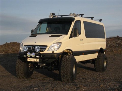 1990 Ford Bronco - This modified Mercedes-Benz Sprinter van is equipped for off-road adventures with its raised suspension and large tires.