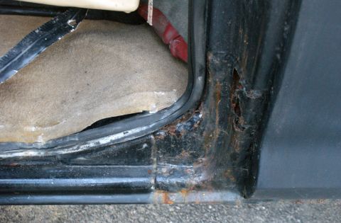 1979 Ford Bronco - Significant rust is visible on the lower door frame and surrounding metalwork.