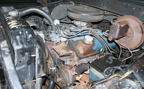 1979 Ford Bronco - Engine bay of a 1979 Ford Bronco, the V8 engine and associated components.