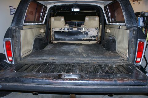 1979 Ford Bronco - Rear view of a 1979 Ford Bronco, interior shows wear and tear in the cargo space.