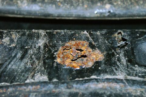 1979 Ford Bronco - This image shows significant rust damage on a vehicle's metal frame, indicating potential structural weakness.