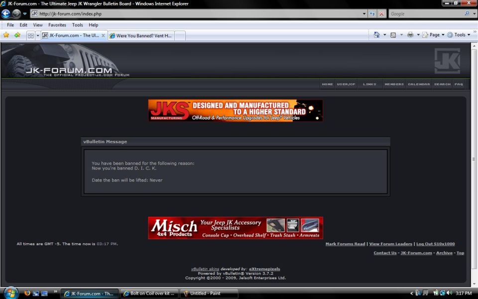 Computer screen displaying a forum ban message stating 'You have been banned for the following reason: Now you're banned D.T.C.K. Date the ban will be lifted: Never.'