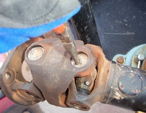 1990 Ford Bronco - Begin by removing the exterior snap rings which retain the u-joint caps