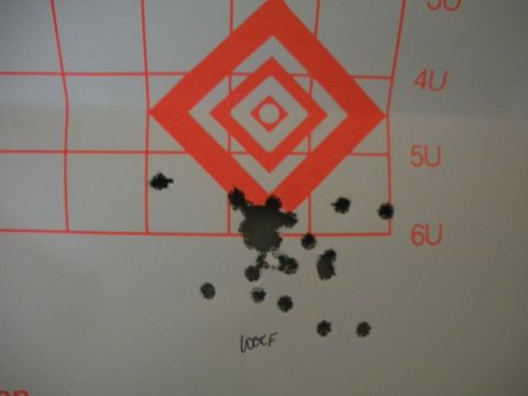 1996 Ford Bronco - A target shows the results of shooting practice, with numerous bullet impacts clustered around the center.