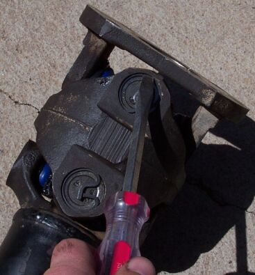 1990 Ford Bronco - Let the rear axle free-hang and check for binding by turning the d/s. If binding is detected you can grind a bit here......