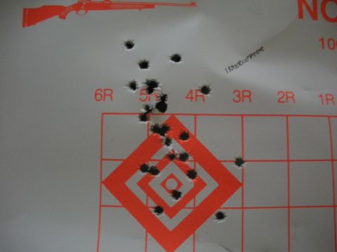 1996 Ford Bronco - A target displays numerous bullet impacts around a central orange diamond grid.