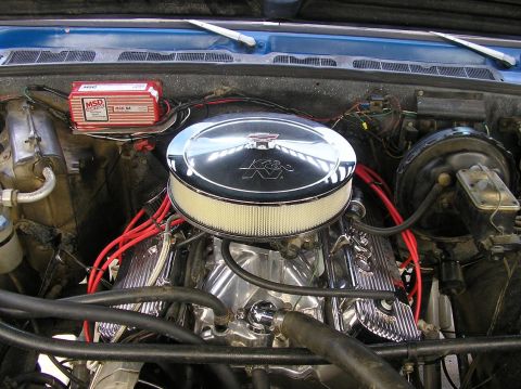 1979 Chevrolet C/K Pickup - The engine bay of a 1979 Chevrolet C/K Pickup, a chrome K&N air filter and a red MSD ignition box.