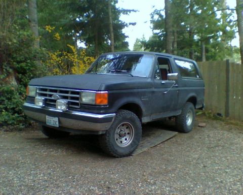 1987 Ford Bronco - This 1987 Ford Bronco is parked outdoors, showing its front three-quarter view.
