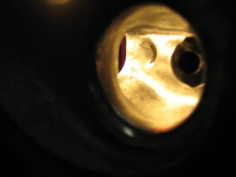 1994 Ford Bronco - Close-up view inside an engine cylinder, revealing internal components and a glimpse of a valve.