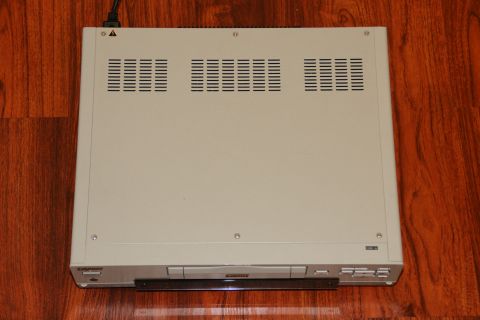 1993 Ford Taurus - A beige electronic device, possibly a VCR or similar, is shown from a top-down perspective on its front.