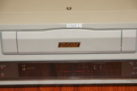 1993 Ford Taurus - A DVCAM video recorder is shown with a label indicating 'UNIT 1' and a digital display.