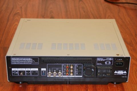 1993 Ford Taurus - The rear panel of a Sony digital video cassette recorder displays numerous connection ports and ventilation grilles.