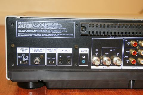 1993 Ford Taurus - The rear panel of a VCR displays numerous connection ports and regulatory text.