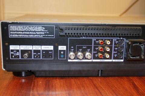 1993 Ford Taurus - Rear panel of an electronic device with multiple input and output connectors for video, audio, and control signals.