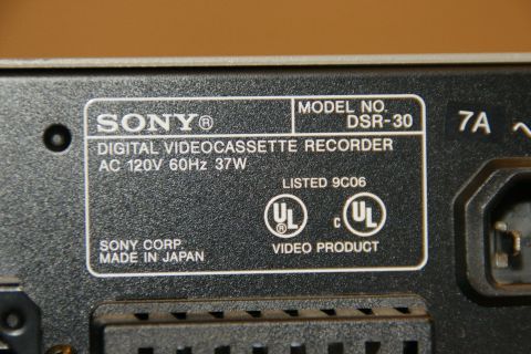 1993 Ford Taurus - Close-up of the label on a Sony digital videocassette recorder, indicating it is a DSR-30 model made in Japan.