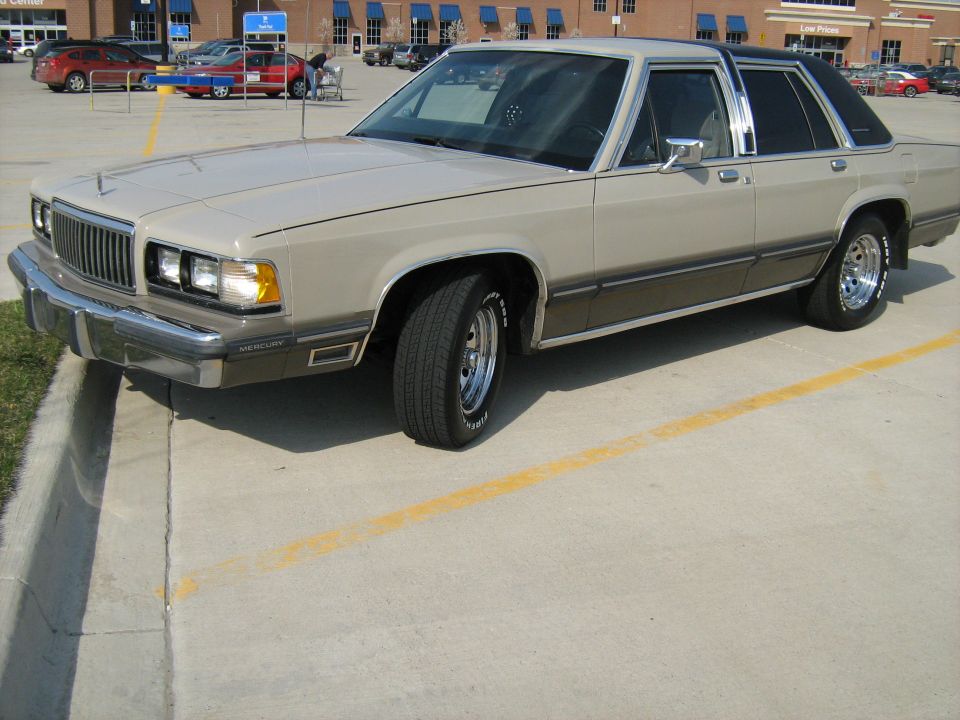 1988 Mercury Grand Marquis sedan parked in a lot, tan and brown two-tone paint
