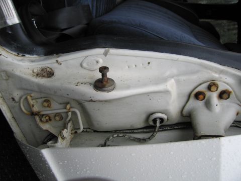 1991 Ford LTD Crown Victoria - Detail of the interior door jamb area, including the door latch and wiring harness.