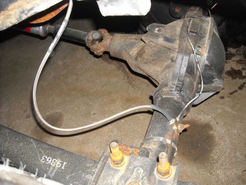1979 Ford F-150 - Close-up view of a vehicle's rear axle differential and driveshaft, showing attached wiring and components.