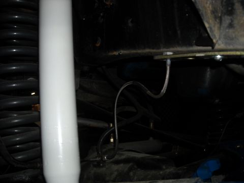 1979 Ford F-150 - Undercarriage view showing suspension parts and brake lines.