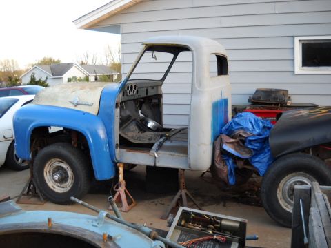 1954 Ford F-100 - This 1954 Ford F-100 truck cab is undergoing restoration, supported by jack stands.