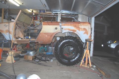1961 International Scout 800 - This 1961 International Scout 800 is in a garage, undergoing body modifications and repairs.