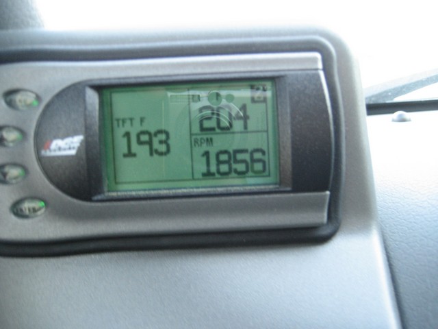 Edge Products digital gauge in a gray dash pod showing trans temp 193 and 1856 RPM