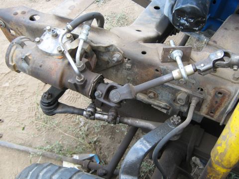 1972 Ford F-250 - The steering and suspension system of a truck is shown in this close-up view.