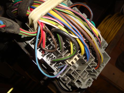 1995 Ford Taurus - Automotive wiring harness connector with a bundle of multi-colored wires.