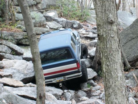 1986 Ford Bronco - 1986 Ford Bronco tackles a challenging rocky off-road course.