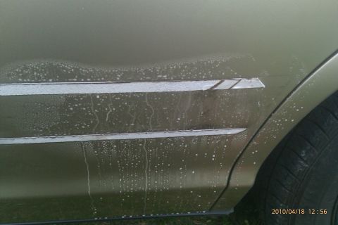 2000 Mercury Grand Marquis - Side view of a 2000 Mercury Grand Marquis door trim showing water spots.