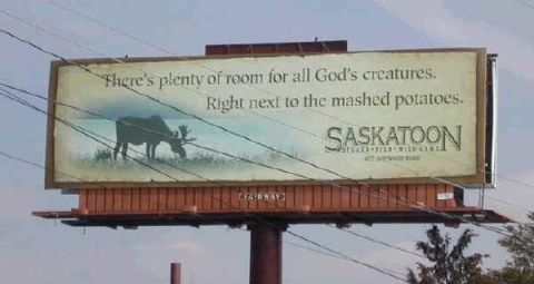 1995 Ford Bronco - Billboard for Saskatoon Steaks Fish Wildgame features a moose and humorous text about dining.