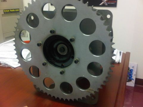 1996 Ford Bronco - Close-up of a large metal sprocket, likely a component from machinery or a vehicle drivetrain.