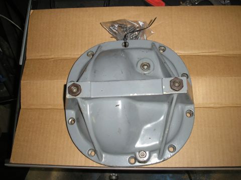 1995 Ford Bronco - A gray differential cover is shown with a bag of fasteners.