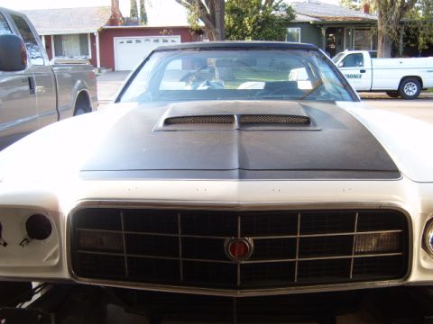 1973 Ford Ranchero - Front view of a 1973 Ford Ranchero, showing its distinctive grille and hood scoop.