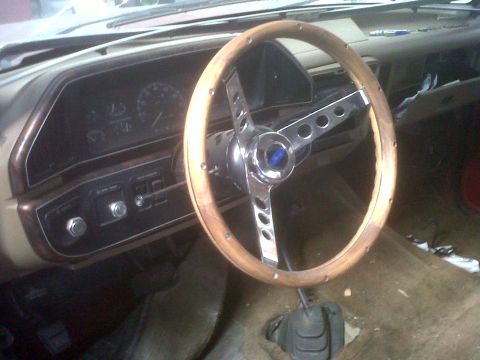 1989 Ford Bronco - The dashboard and steering wheel of a vehicle are visible in this interior shot.
