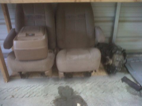 1989 Ford Bronco - Car seats and a transmission are shown, not a complete 1989 Ford Bronco.