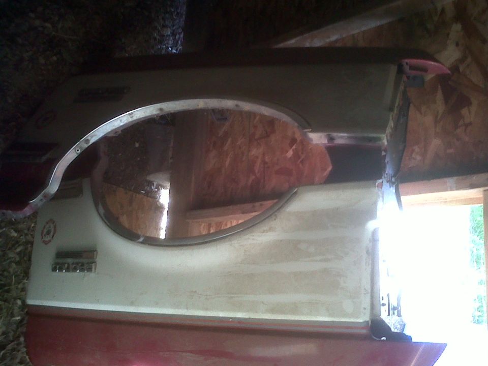 Rear fender panel with trim and emblem cutout