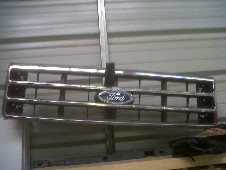 Ford grille with blue oval emblem, looks like it's from an 80s or early 90s truck