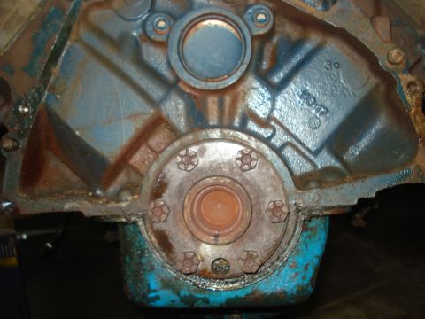 1979 Ford Bronco - Close-up view of an engine block, showing casting marks and a bolted flange.