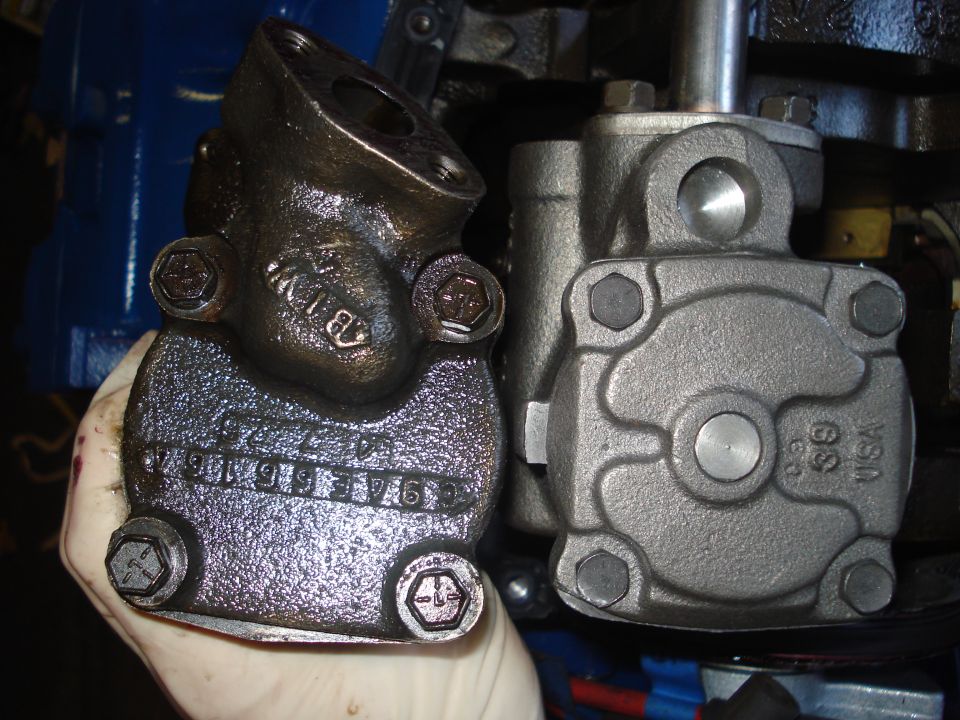 Comparison of old and new oil pumps, with part numbers visible on the old pump