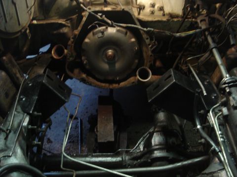 1979 Ford Bronco - Underside view of transmission and drivetrain components, likely during a repair or rebuild.