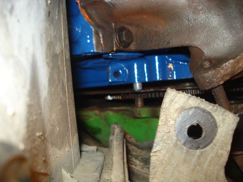 1979 Ford Bronco - Close-up view of engine components, including a blue-painted block and metal parts.