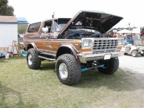 1994 Ford Bronco - This lifted 1978 Ford Bronco is displayed with its hood open, revealing the engine compartment.