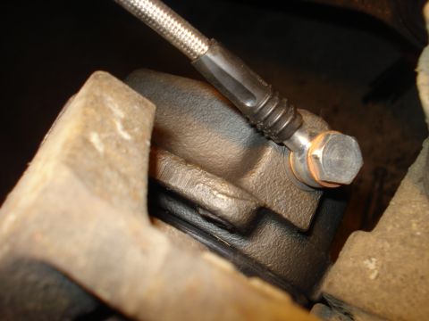 1979 Ford Bronco - Brake caliper and hose assembly, likely from a truck or SUV.